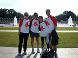 PCAOB staffers Annie Braswell, Courtney Payne, Lucia Carromba  and an unnamed intern  play softball on the national mall. 