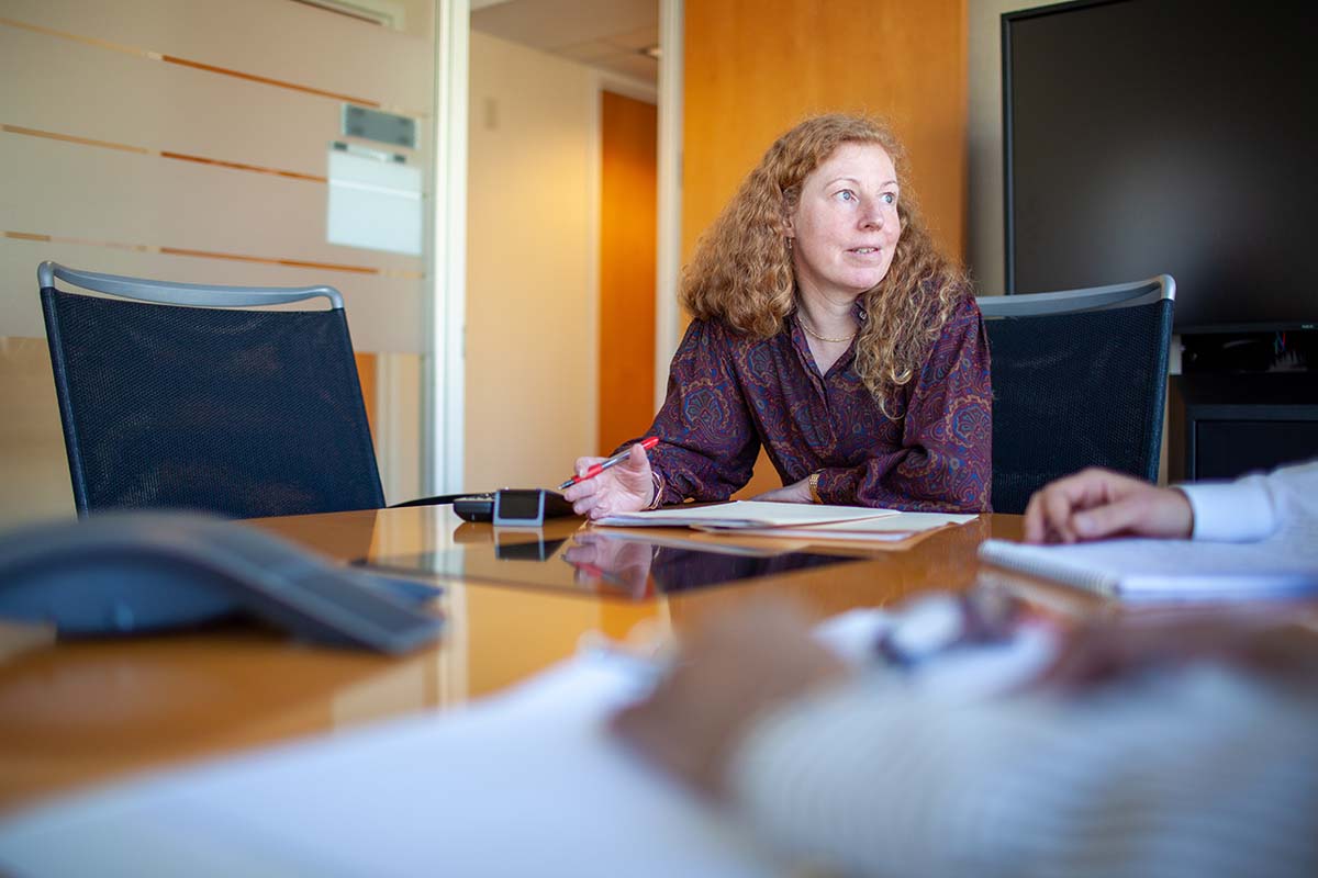 Patty Thompson sitting at a large desk.